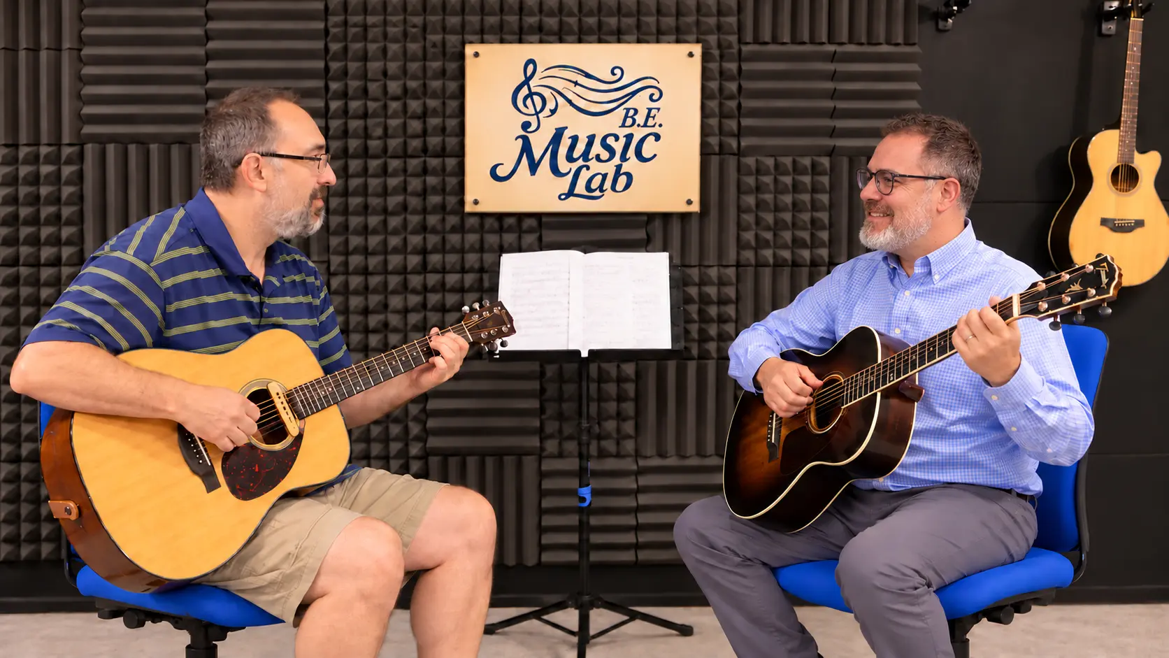 Jeremiah Williams teaching guitar to Sean during a B.E. Music Lab lesson